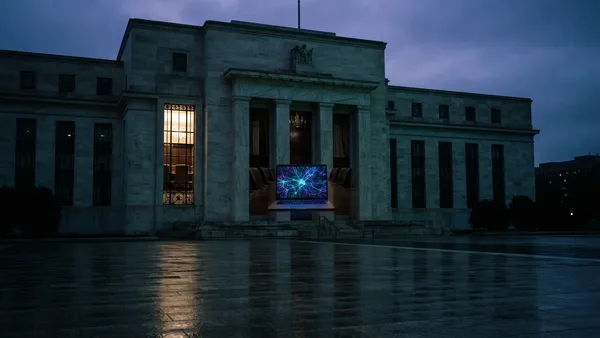 Warsh offers no clues on rates and sees AI lifting productivity